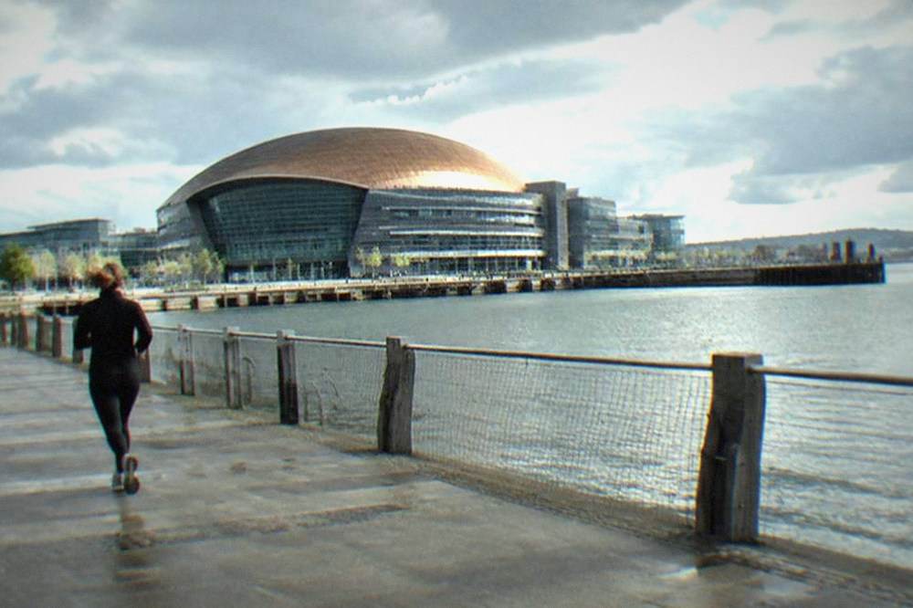 The Wales Millennium Centre seen across the water of Cardiff Bay