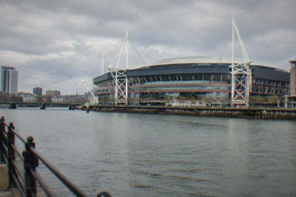 The Principality Stadium rising above the Cardiff city skyline on a clear day