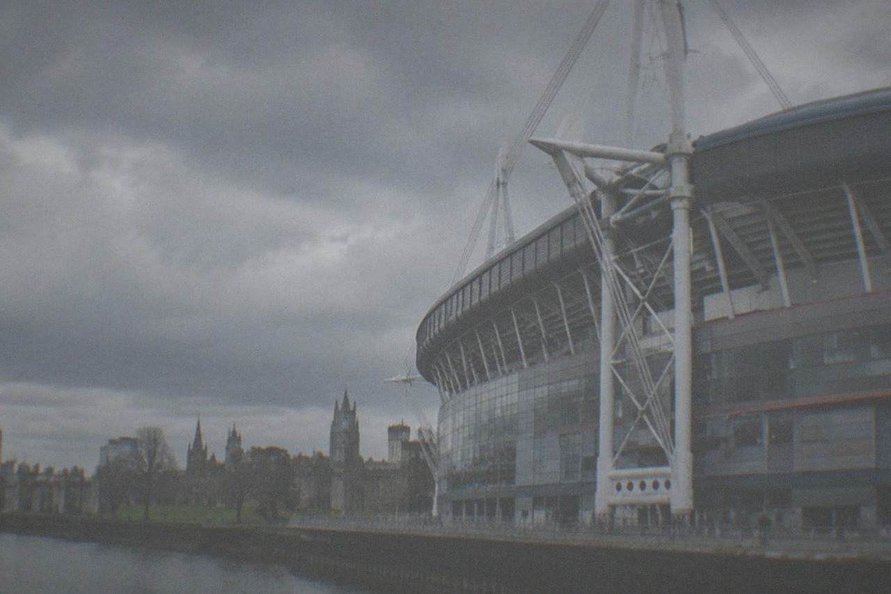Cardiff city centre skyline with the Principality Stadium and castle green in the foreground