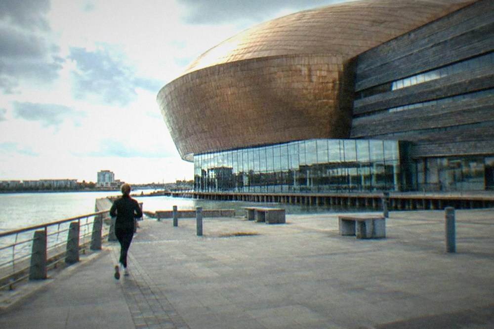 The Wales Millennium Centre facade above the water at Cardiff Bay