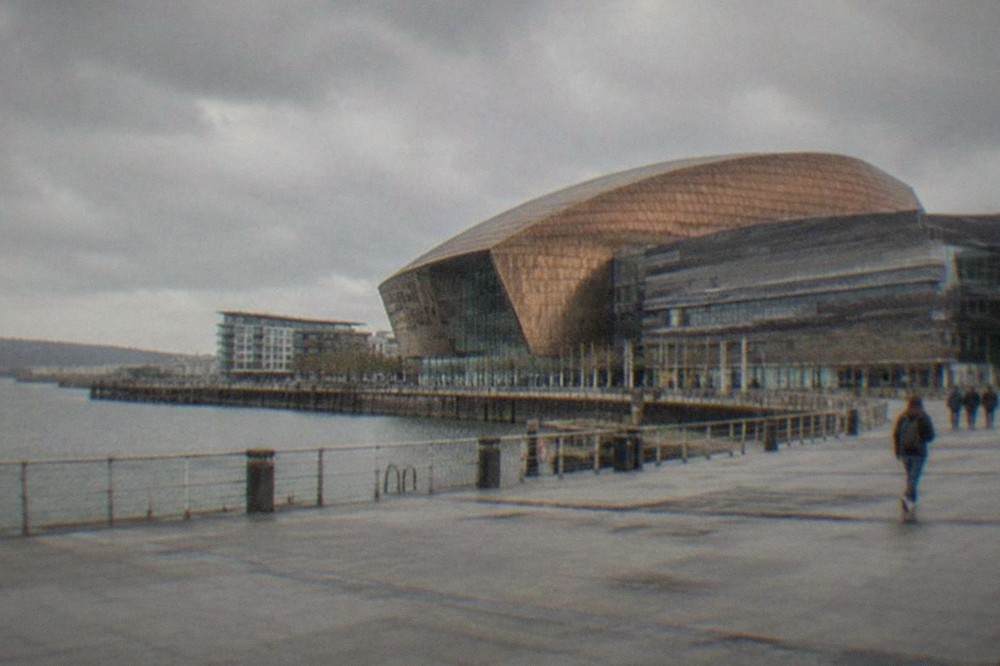 Cardiff Bay waterfront with the Wales Millennium Centre and calm harbour water