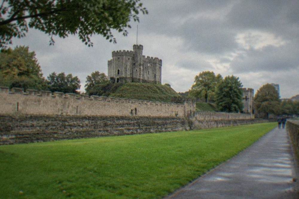 Cardiff Castle keep rising above green lawns in the city centre
