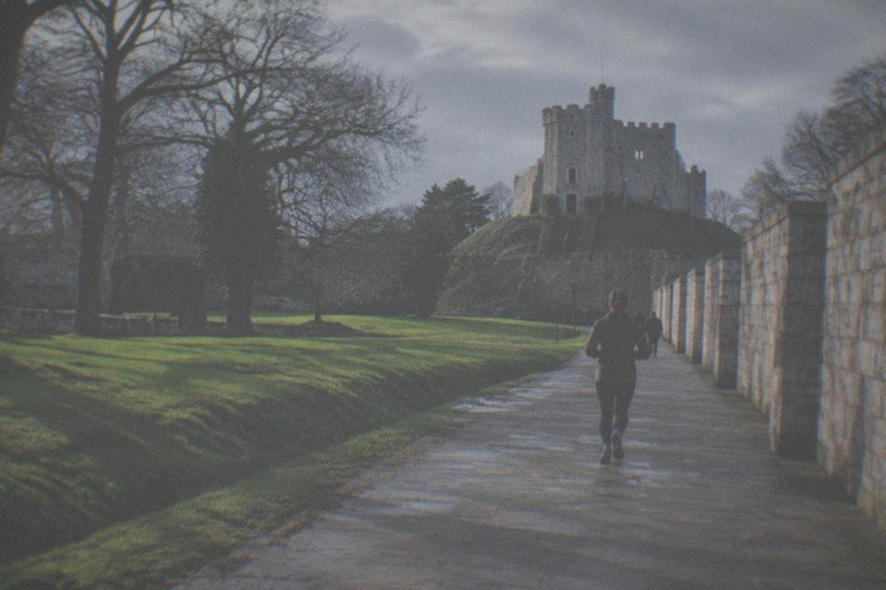 Cardiff Castle keep rising above green lawns in the city centre
