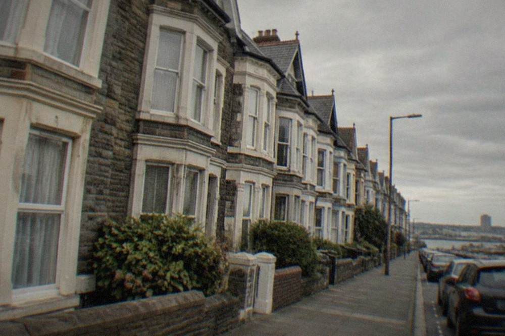 A row of tall Victorian terraced houses with bay windows along a quiet Pontcanna street