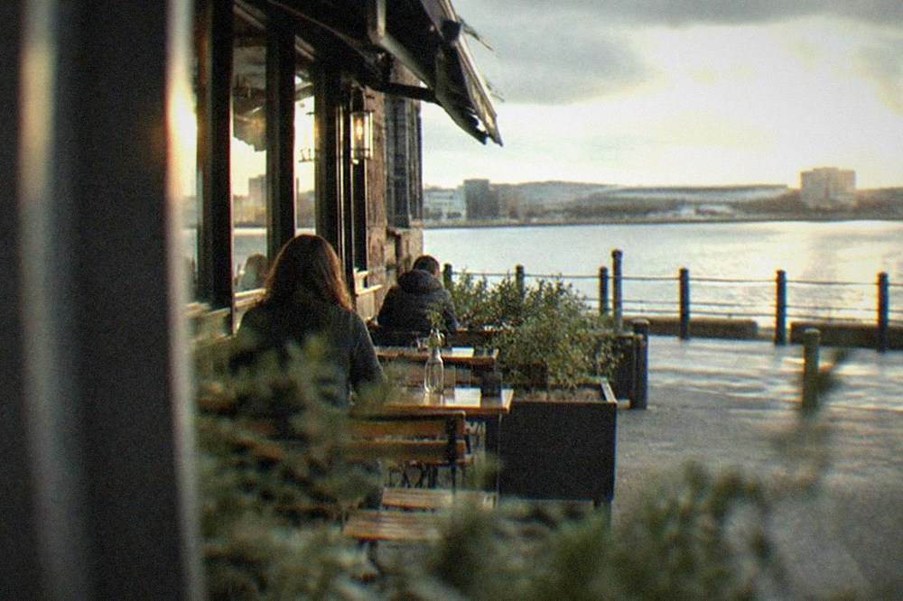 A small independent restaurant frontage with a chalkboard menu on a Pontcanna street corner