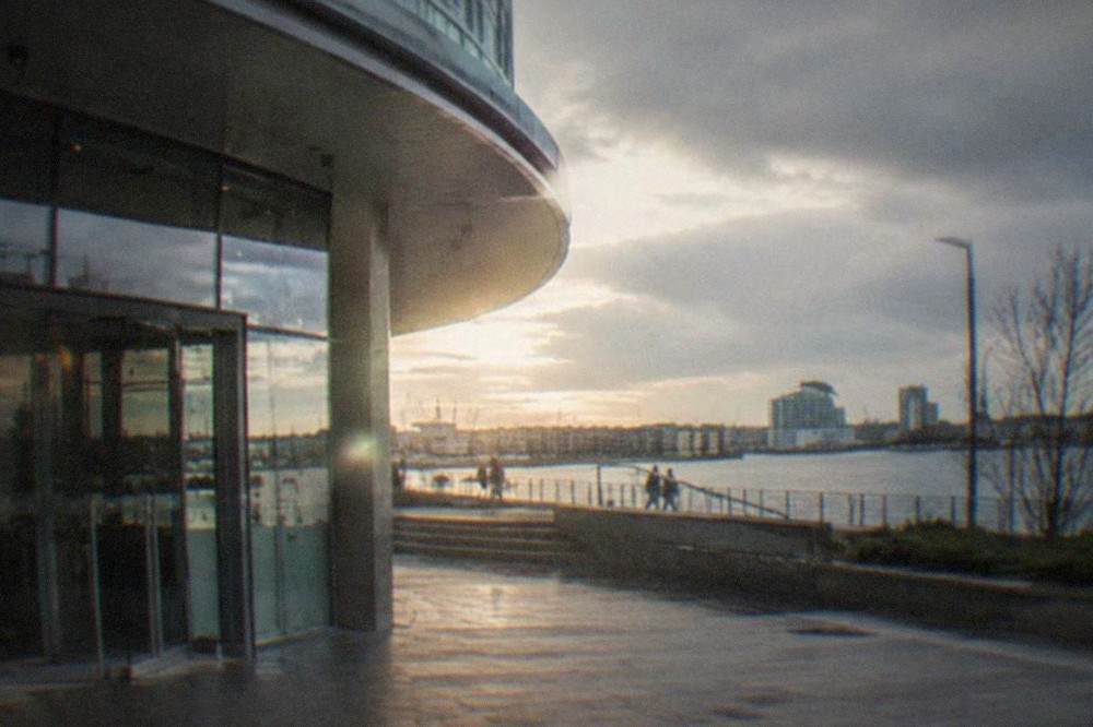 Arts centre building exterior on a quiet Cardiff street with glass entrance doors