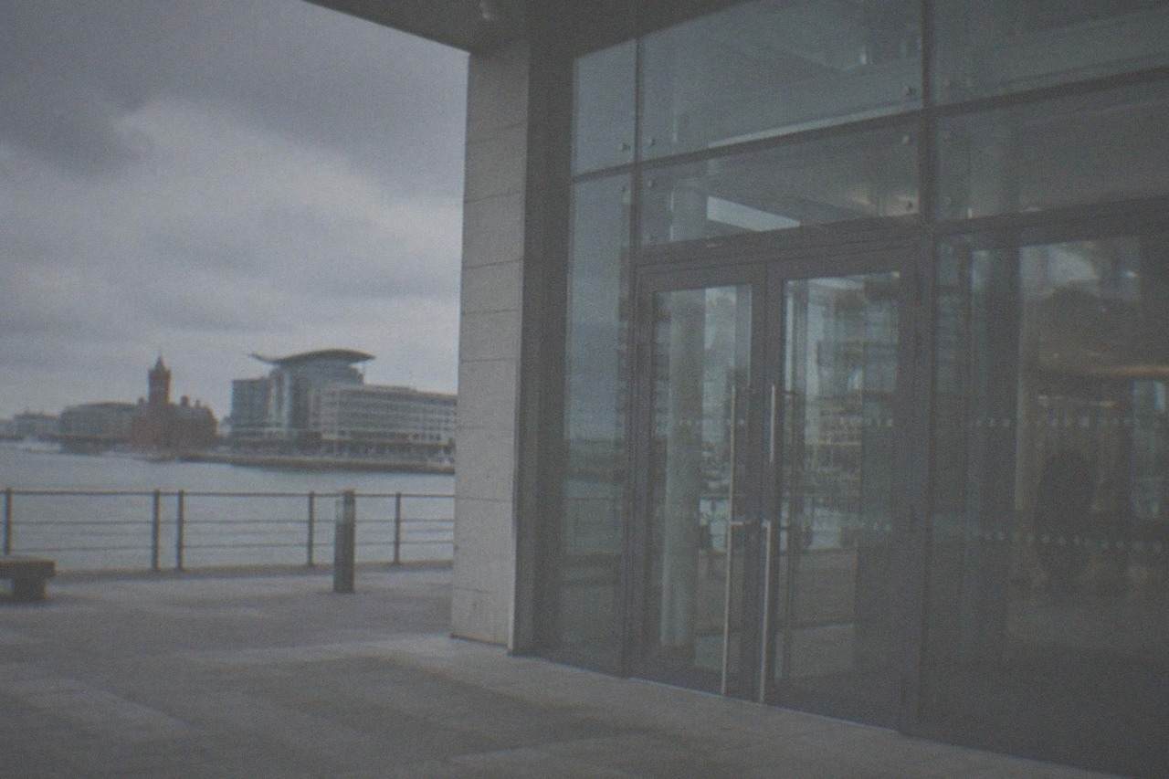 Arts centre building exterior on a quiet Cardiff street with glass entrance doors