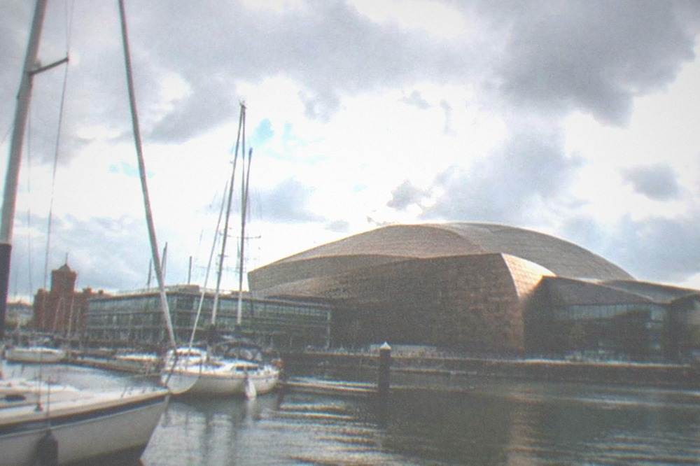 Boats moored in Cardiff Bay with the Wales Millennium Centre behind