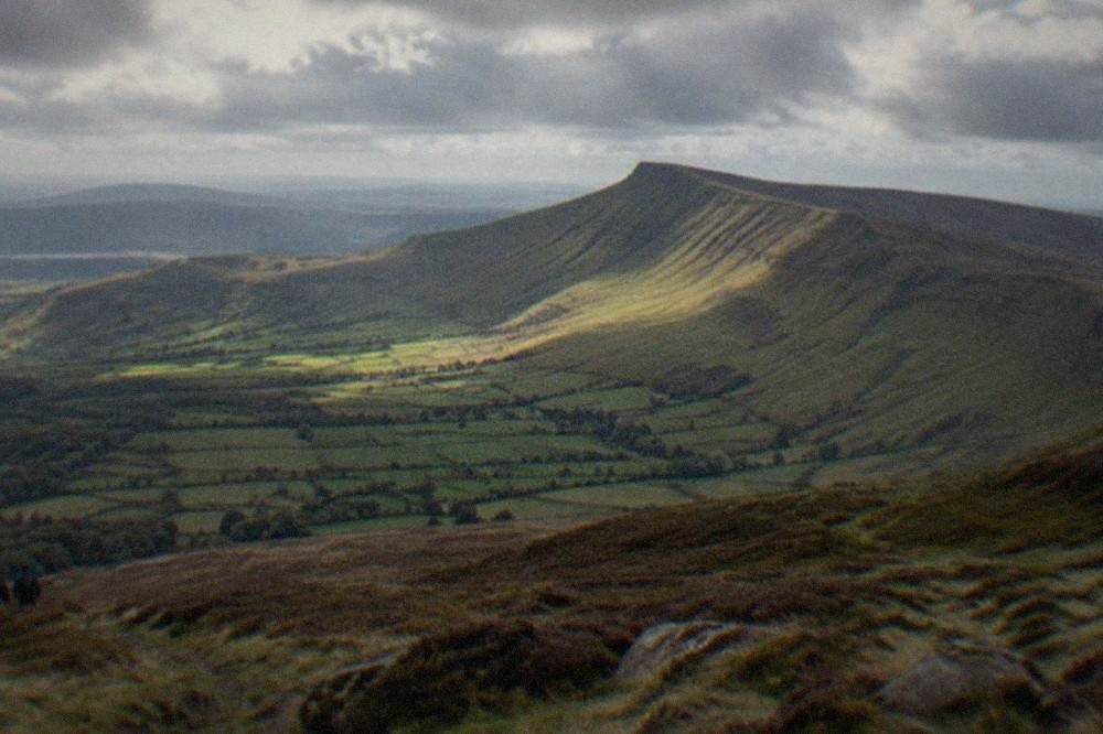 Rolling moorland hills under a wide sky in the Brecon Beacons national park