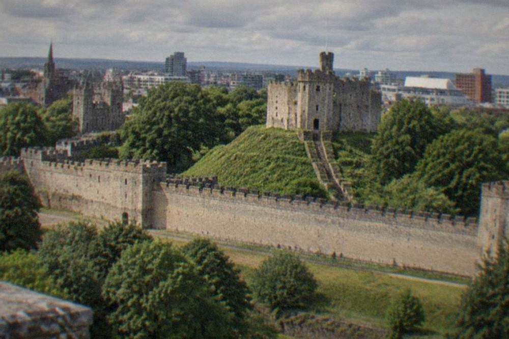Cardiff Castle keep standing above the city skyline on a bright morning