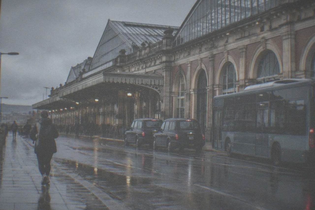 Victorian train shed roof above platforms at a large city railway station