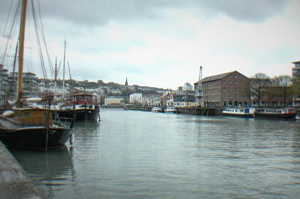 Bristol harbourside with historic boats moored along the water