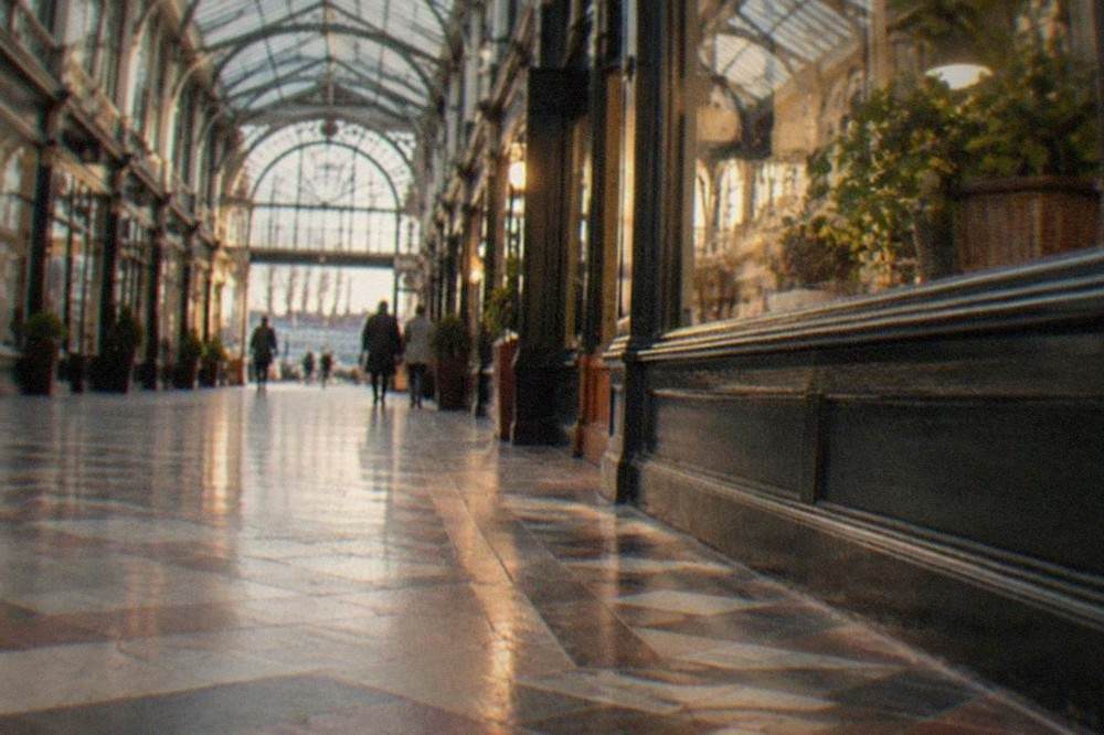 The Victorian and Edwardian arcades in Cardiff city centre with shopfronts under a glass roof