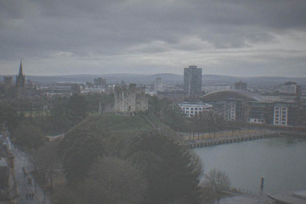 Wide view across Cardiff city centre with the castle keep rising above parkland trees