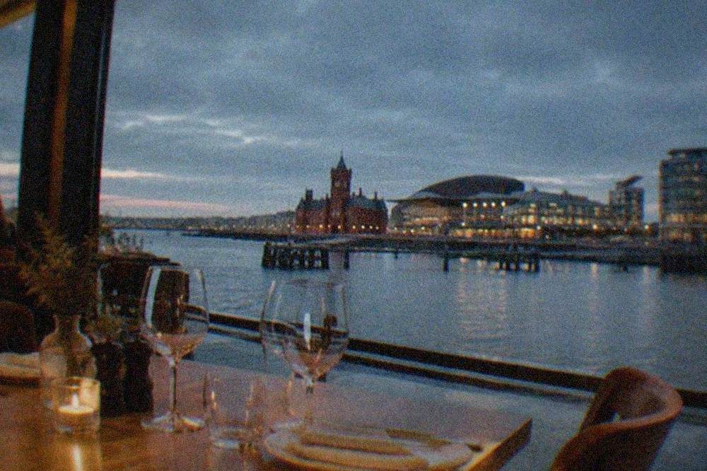 A table set for dinner inside a warmly lit independent Cardiff restaurant