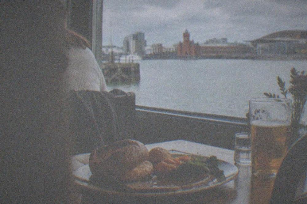 A Sunday roast dinner plated at a Cardiff pub table