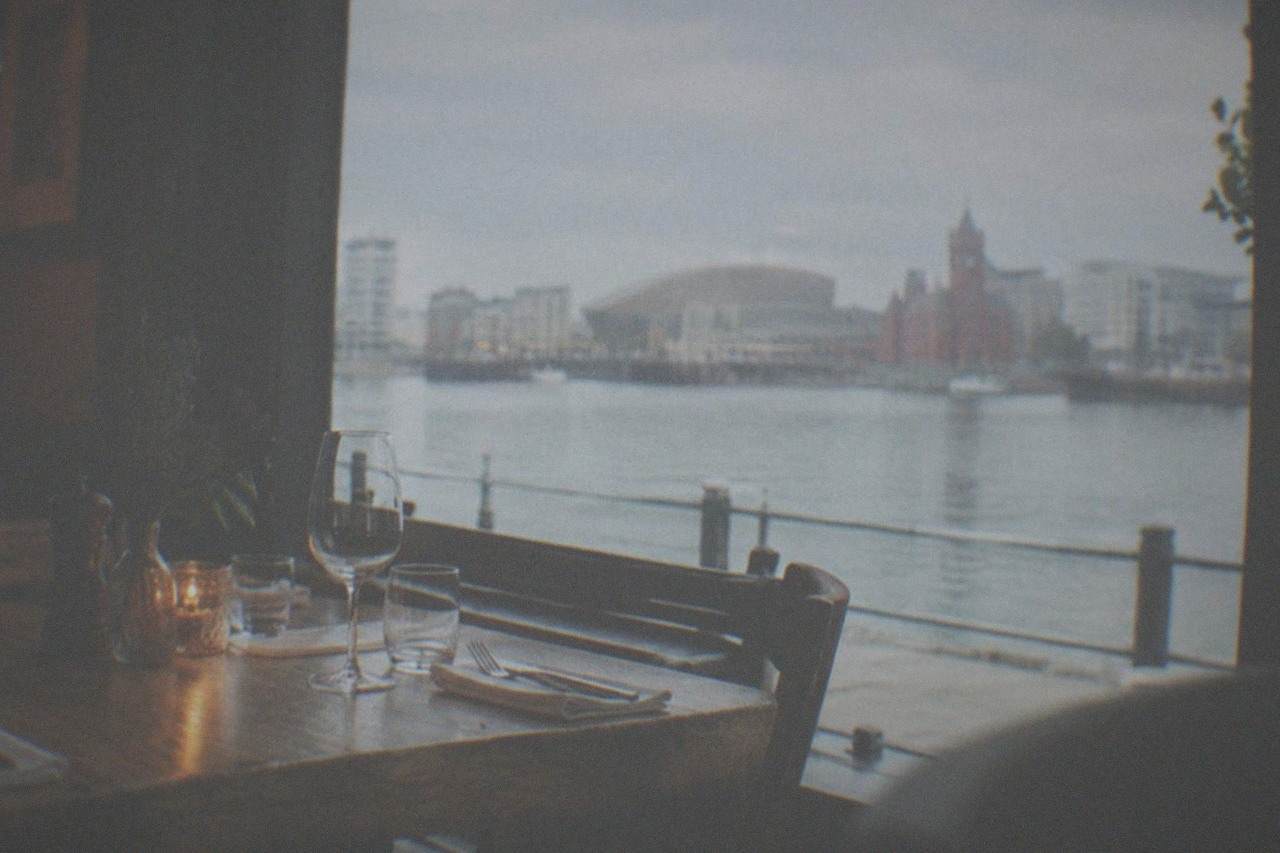 A table set for dinner inside a warmly lit independent Cardiff restaurant
