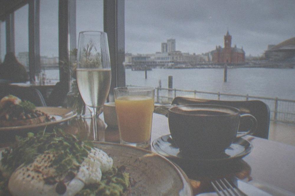 Cardiff restaurant interior with a table set for brunch, plates of food and glasses