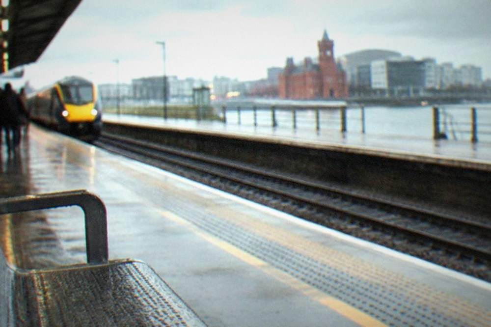 A long-distance train platform at a busy British railway station