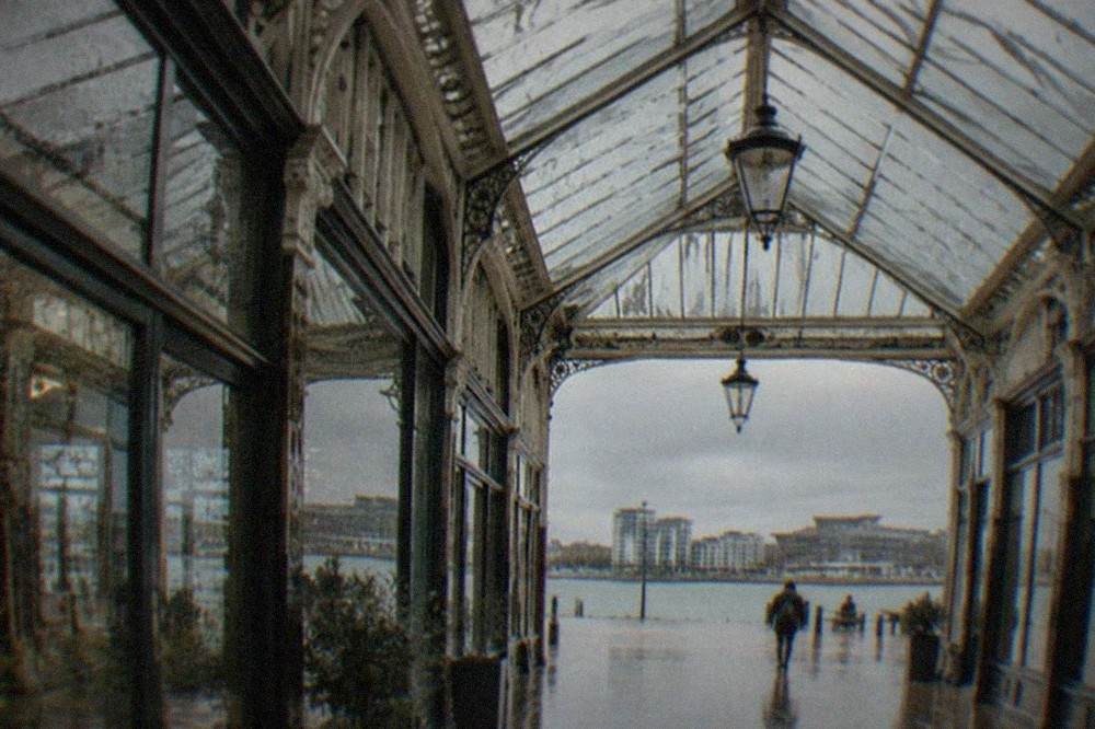 Rain running down the glass panels of a covered Victorian arcade roof in Cardiff