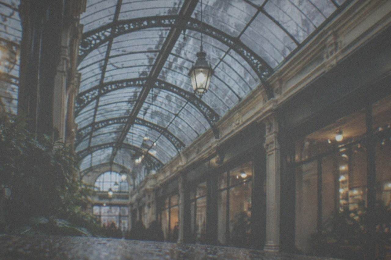 Rain falling on the glass roof of a Victorian shopping arcade in Cardiff