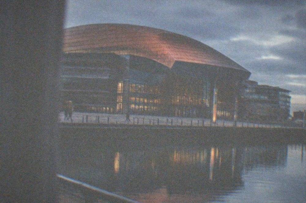 Wales Millennium Centre façade reflected in the Bay water